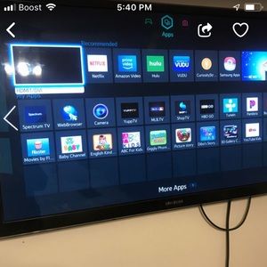 A Samsung smart  tv with 3D glasses and keyboard